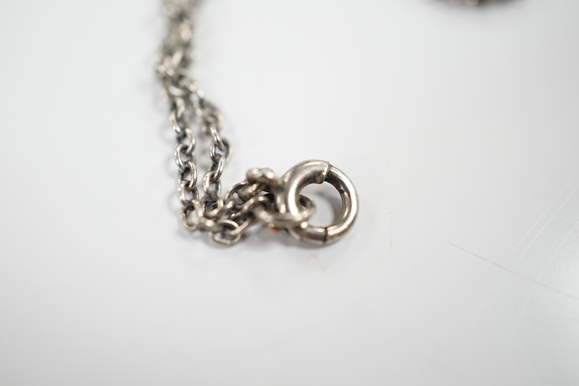 An early to mid 20th century continental 925 white metal, simulated drop pearl and two colour paste set pendant, 58mm, on a white metal chain, 38cm. Condition - good.